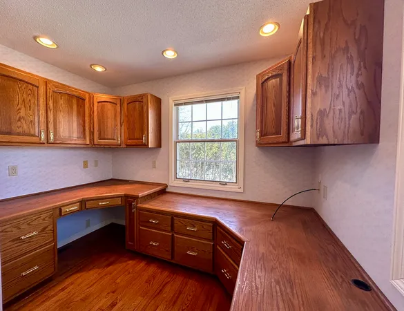 a spacious bathroom with a granite countertop tub sink shower and mirror