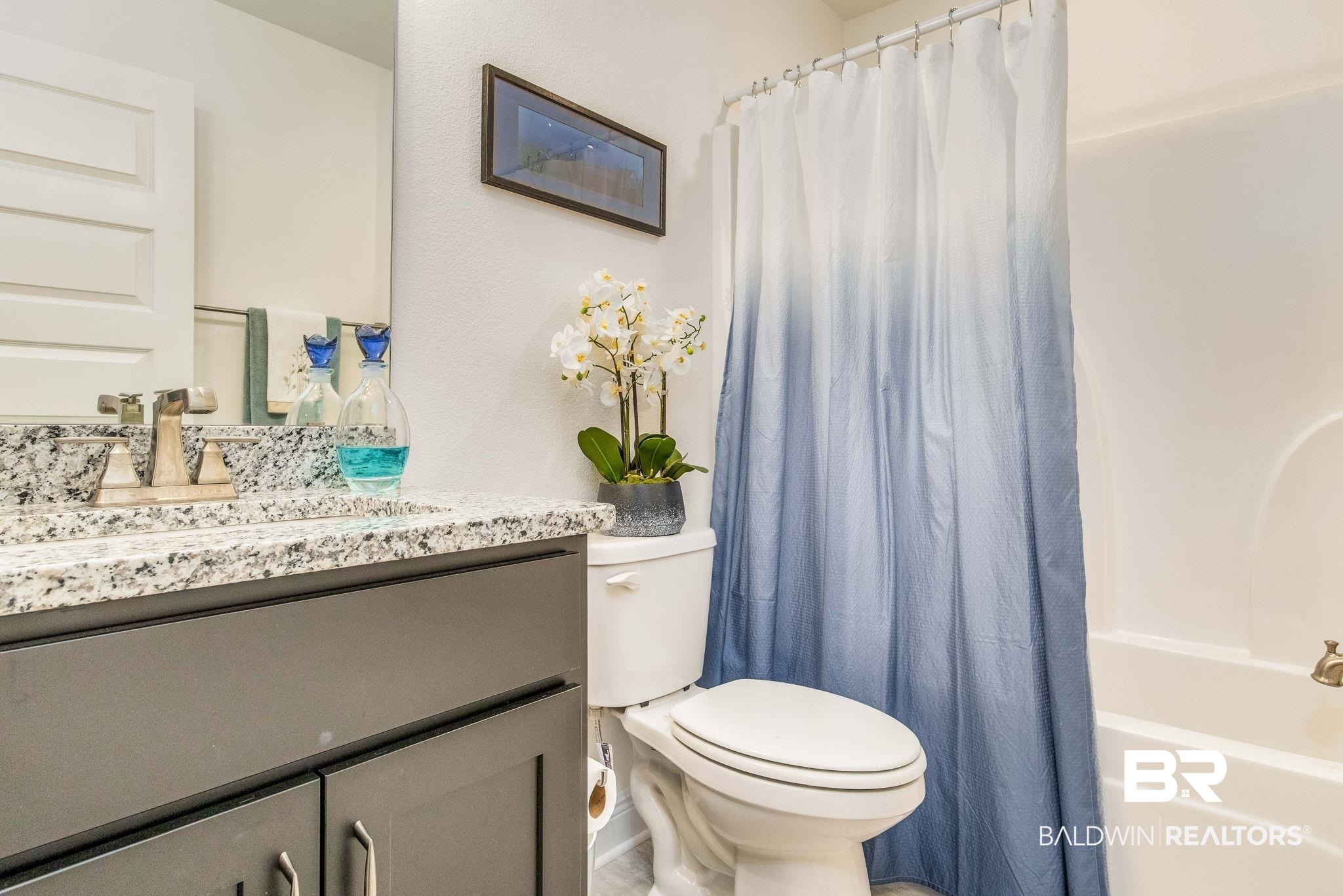 2222 Club House Drive Lillian, AL 36549 - Photo 20 of 49 Full bathroom with vanity and shower / bath combo with shower curtain