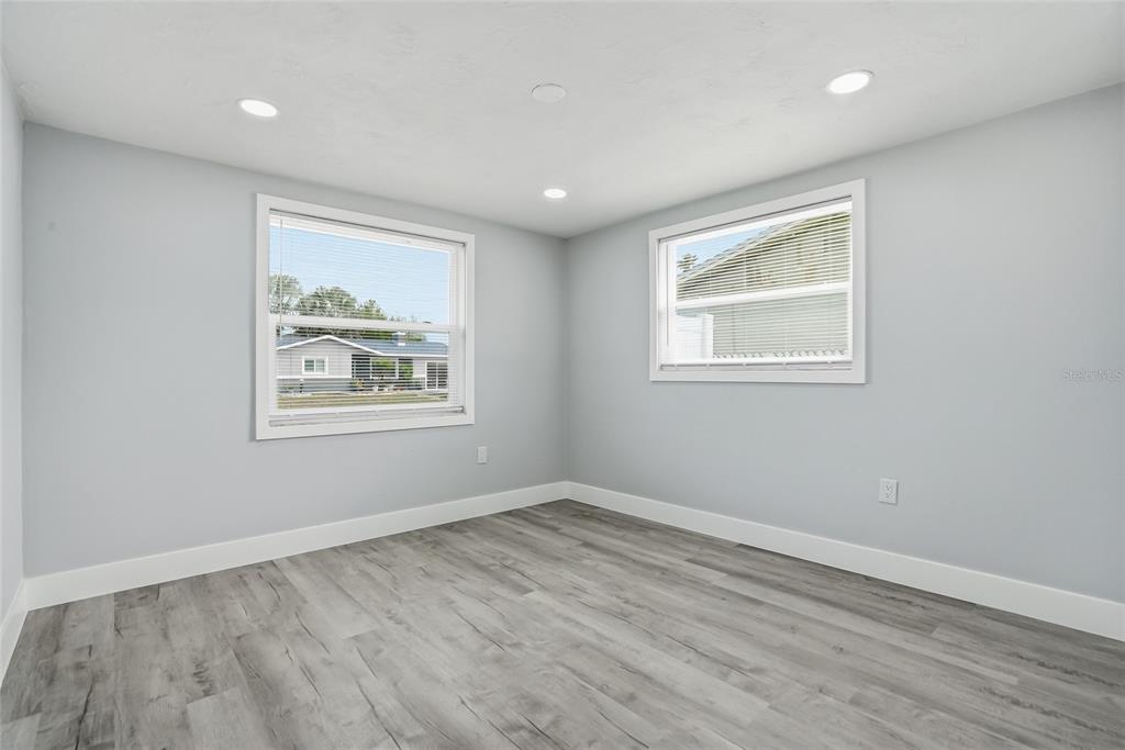 6302 Diamond Drive New Port Richey, FL 34653 - Photo 22 of 43 a view of room with window and hardwood floor