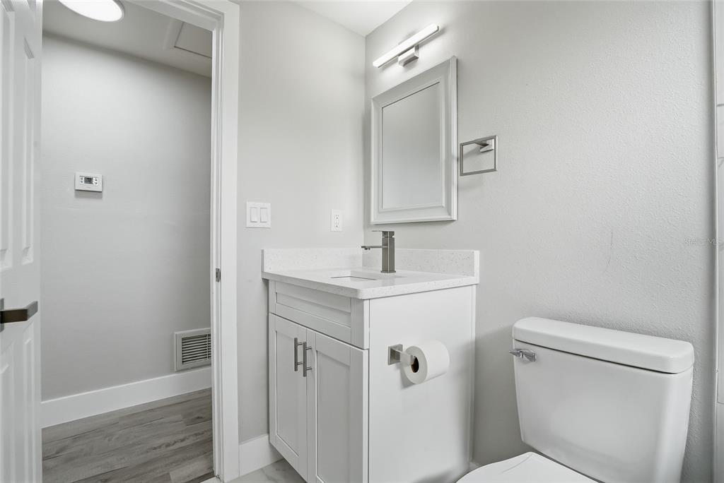 6302 Diamond Drive New Port Richey, FL 34653 - Photo 25 of 43 a bathroom with a sink toilet and shower