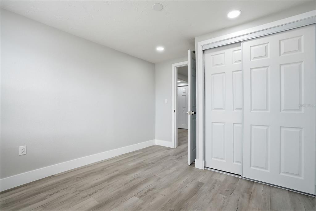 6302 Diamond Drive New Port Richey, FL 34653 - Photo 29 of 43 wooden floor in an empty room