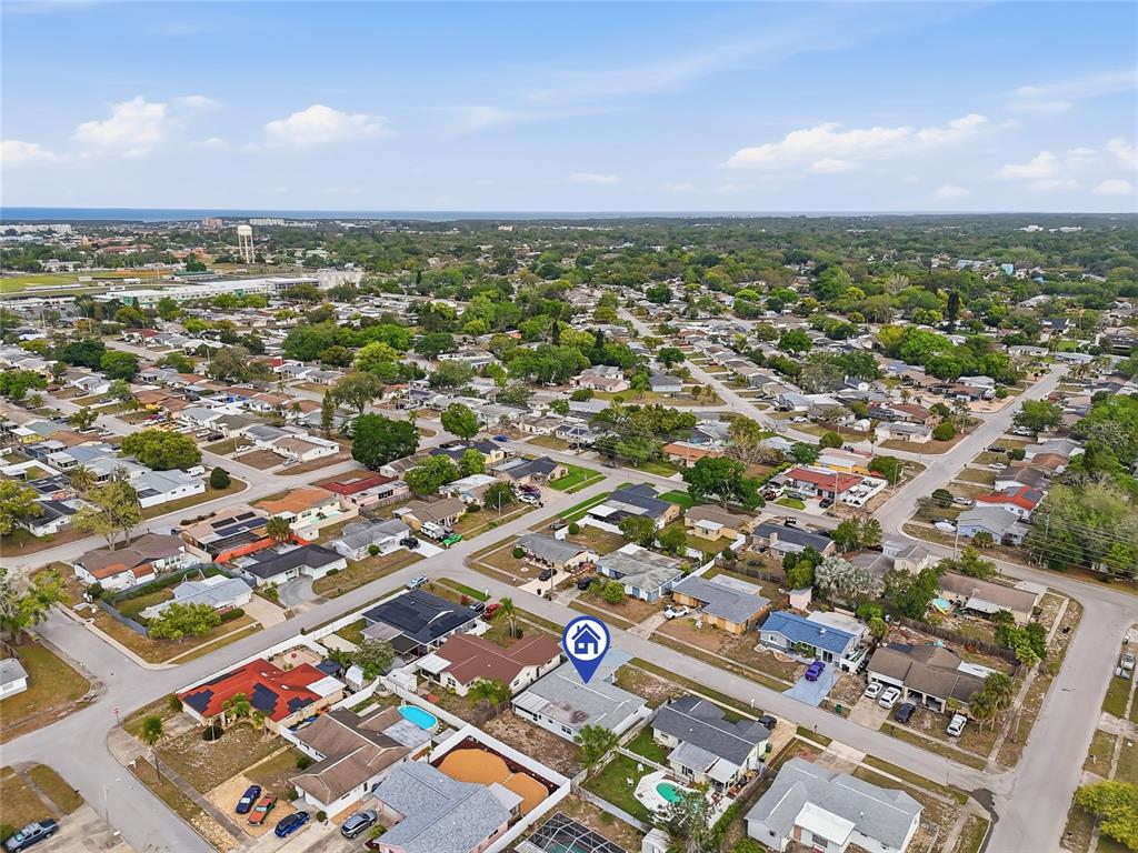 6302 Diamond Drive New Port Richey, FL 34653 - Photo 37 of 43 an aerial view of residential building with green space