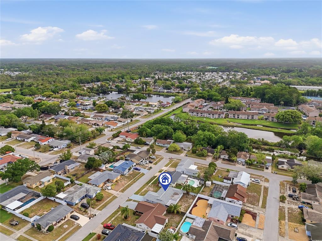 6302 Diamond Drive New Port Richey, FL 34653 - Photo 39 of 43 an aerial view of residential houses with outdoor space