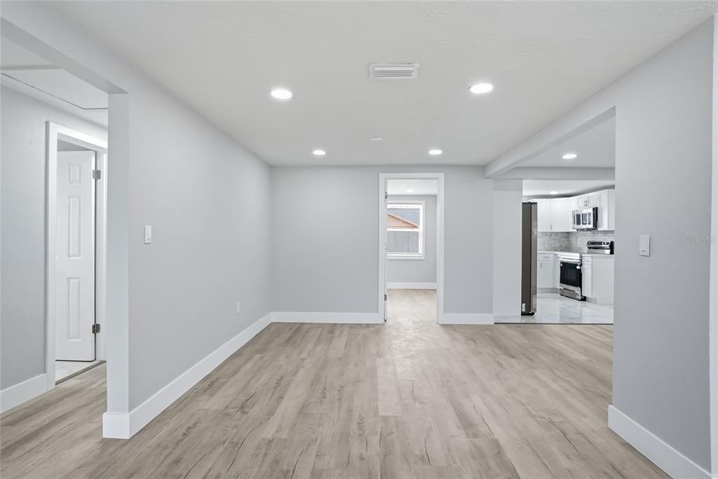 6302 Diamond Drive New Port Richey, FL 34653 - Photo 7 of 43 a view of empty room with wooden floor