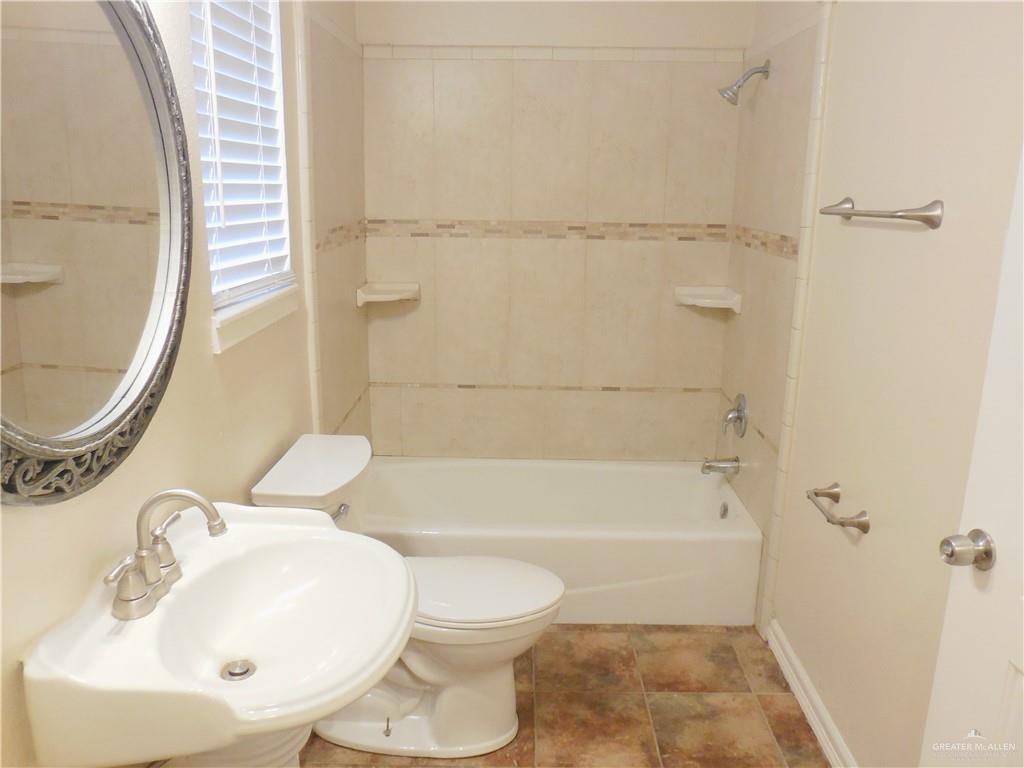 5212-5213 North Taylor Road Mission, TX 78573 - Photo 15 of 20 a bathroom with a sink a toilet and a bathtub