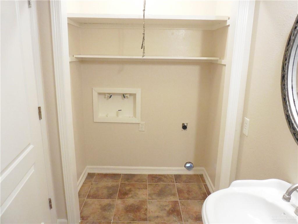 5212-5213 North Taylor Road Mission, TX 78573 - Photo 18 of 20 a bathroom with a sink and a toilet