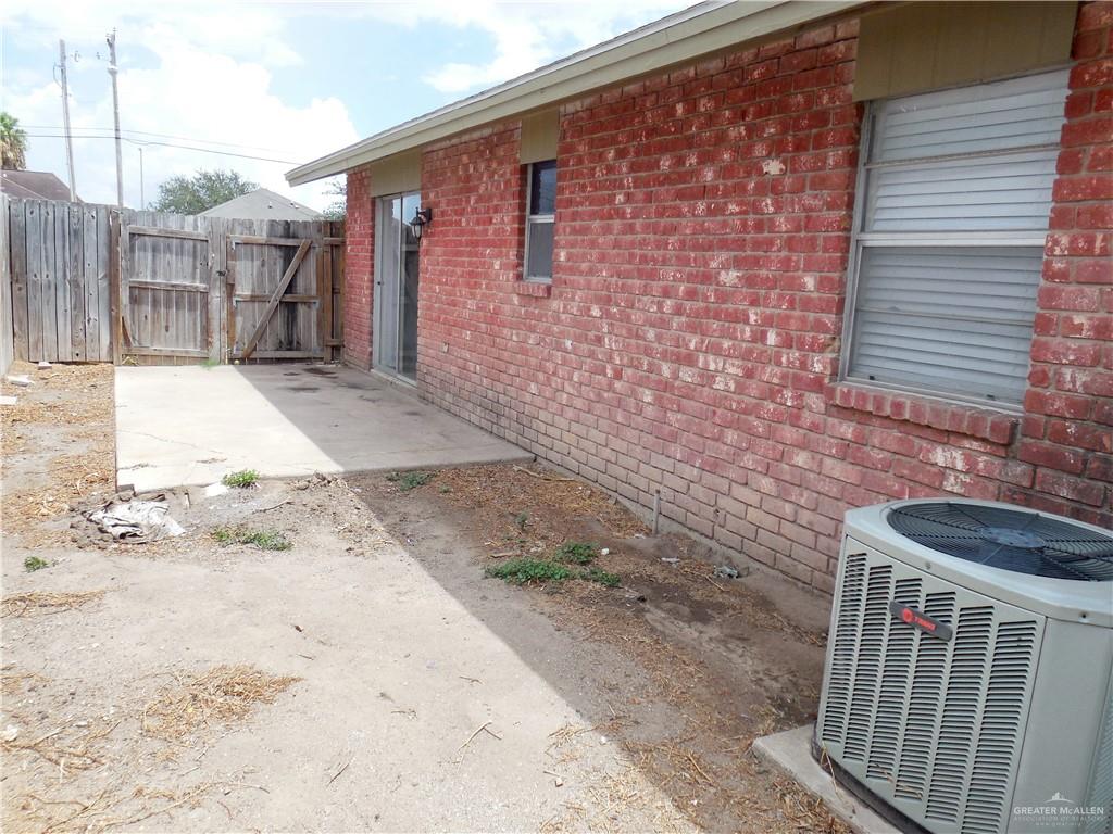 5212-5213 North Taylor Road Mission, TX 78573 - Photo 20 of 20 a view of a backyard with a wooden fence