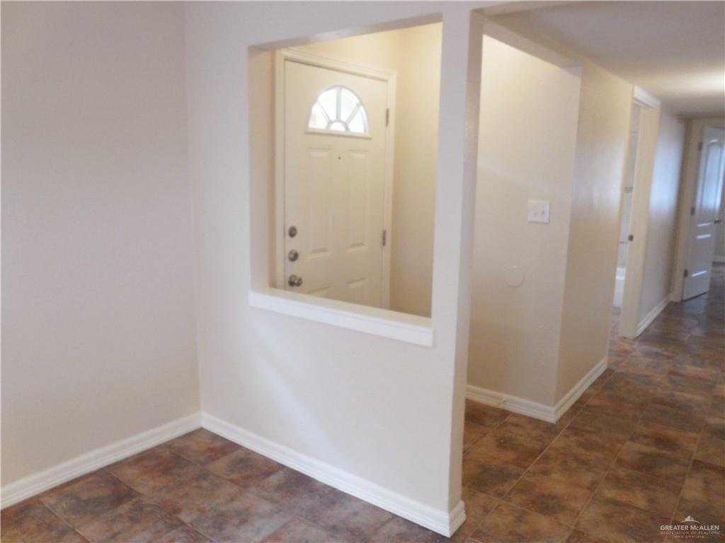 5212-5213 North Taylor Road Mission, TX 78573 - Photo 2 of 20 an empty room with windows