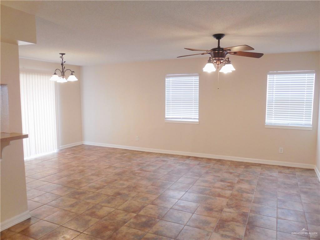 5212-5213 North Taylor Road Mission, TX 78573 - Photo 6 of 20 an empty room with fan and windows