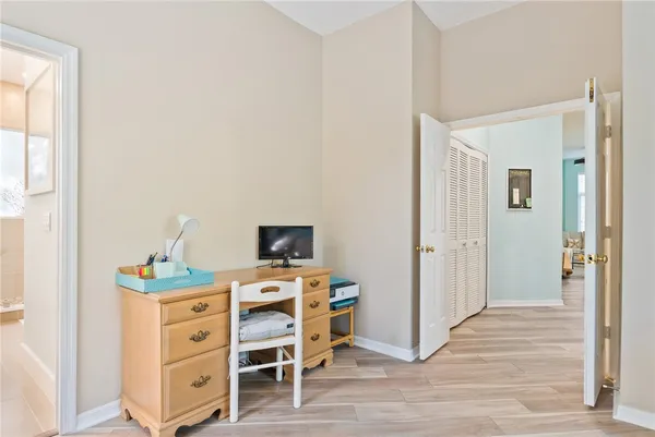 a bed room with a bed and a chair