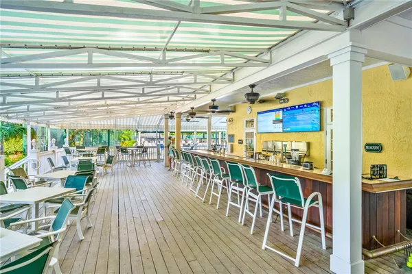 a view of a patio with a table and chairs