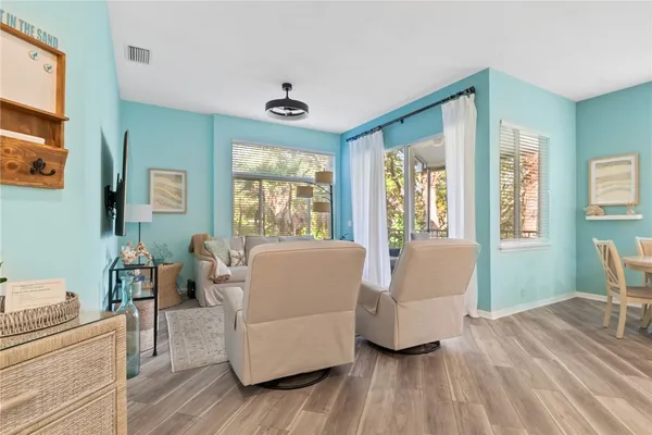 a living room with furniture and a large window