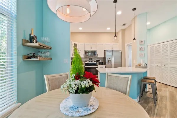 a dining table chair with a kitchen view