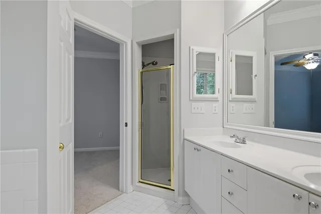 a spacious bathroom with a shower and a sink
