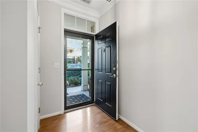 a view of entryway with wooden floor
