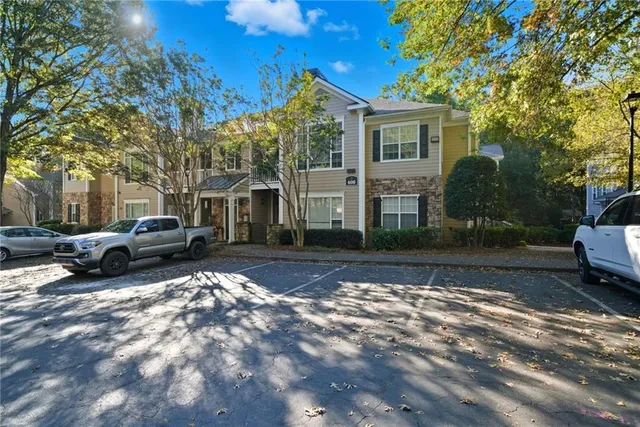 a view of a car park in front of house