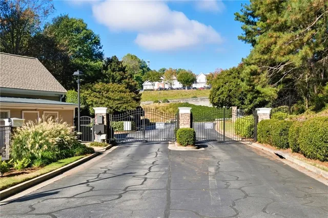 a view of a garden with wooden fence