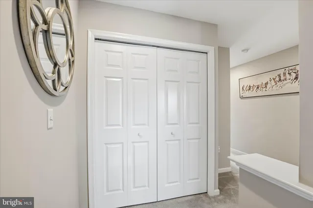 a view of a hallway with washer and dryer