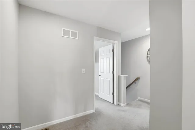 a view of a room with a hallway