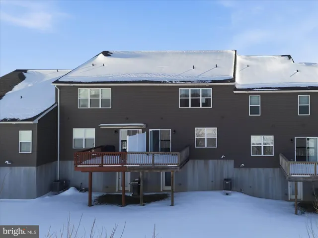 a aerial view of a house with sitting area