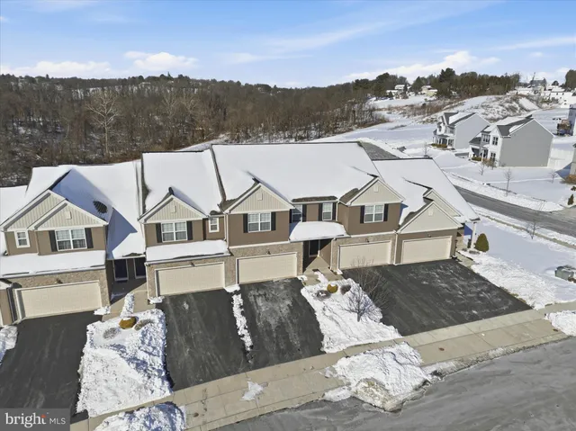 a view of a house with a bed in the background