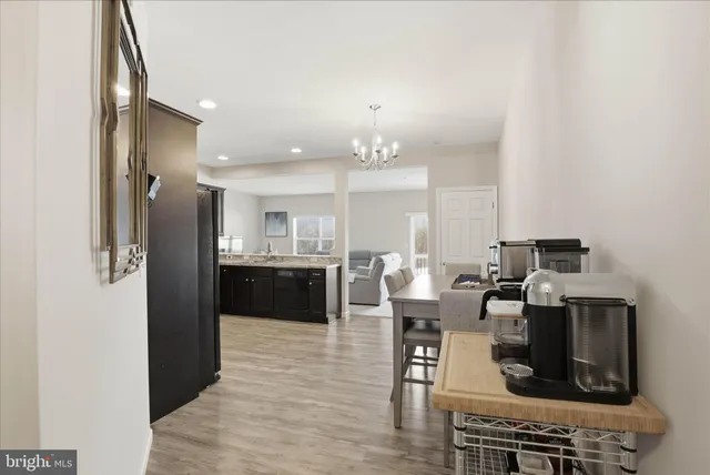 a kitchen with stainless steel appliances granite countertop a refrigerator and a stove