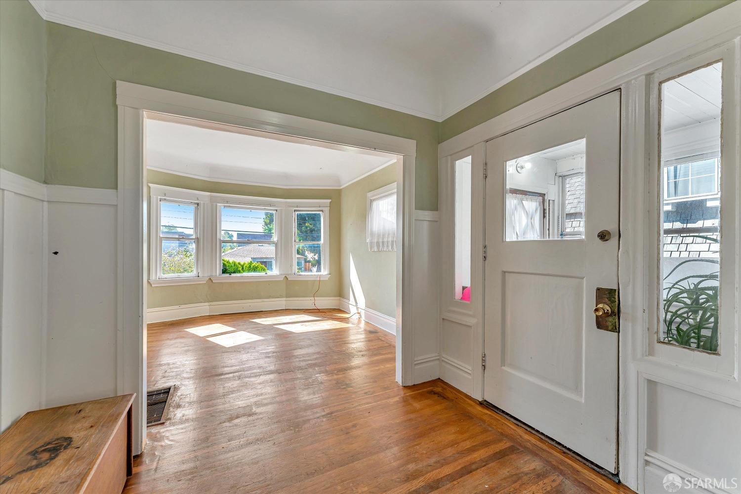 1917 Oregon Street Berkeley, CA 94703 - Photo 1 of 43 wooden floor in an empty room with a window