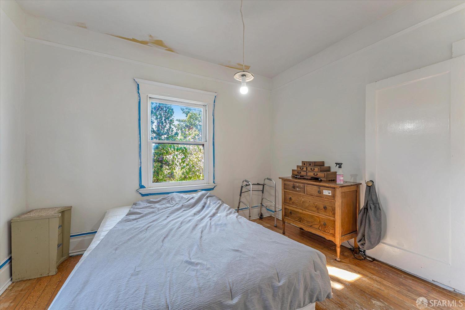 1917 Oregon Street Berkeley, CA 94703 - Photo 25 of 43 a bedroom with a bed and a window