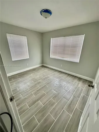 a view of an empty room with a window