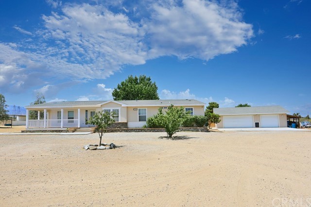 11460 Paramount Road Phelan, CA 92371 - Photo 1 of 1 a view of a house with a patio