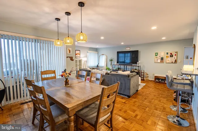 a dining room filled with furniture and a chandelier