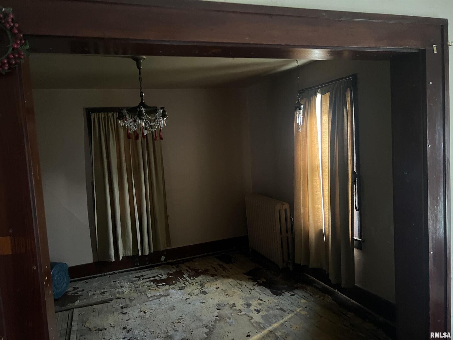 103 South 6th Street Clinton, IA 52732 - Photo 3 of 7 wooden floor in an empty room
