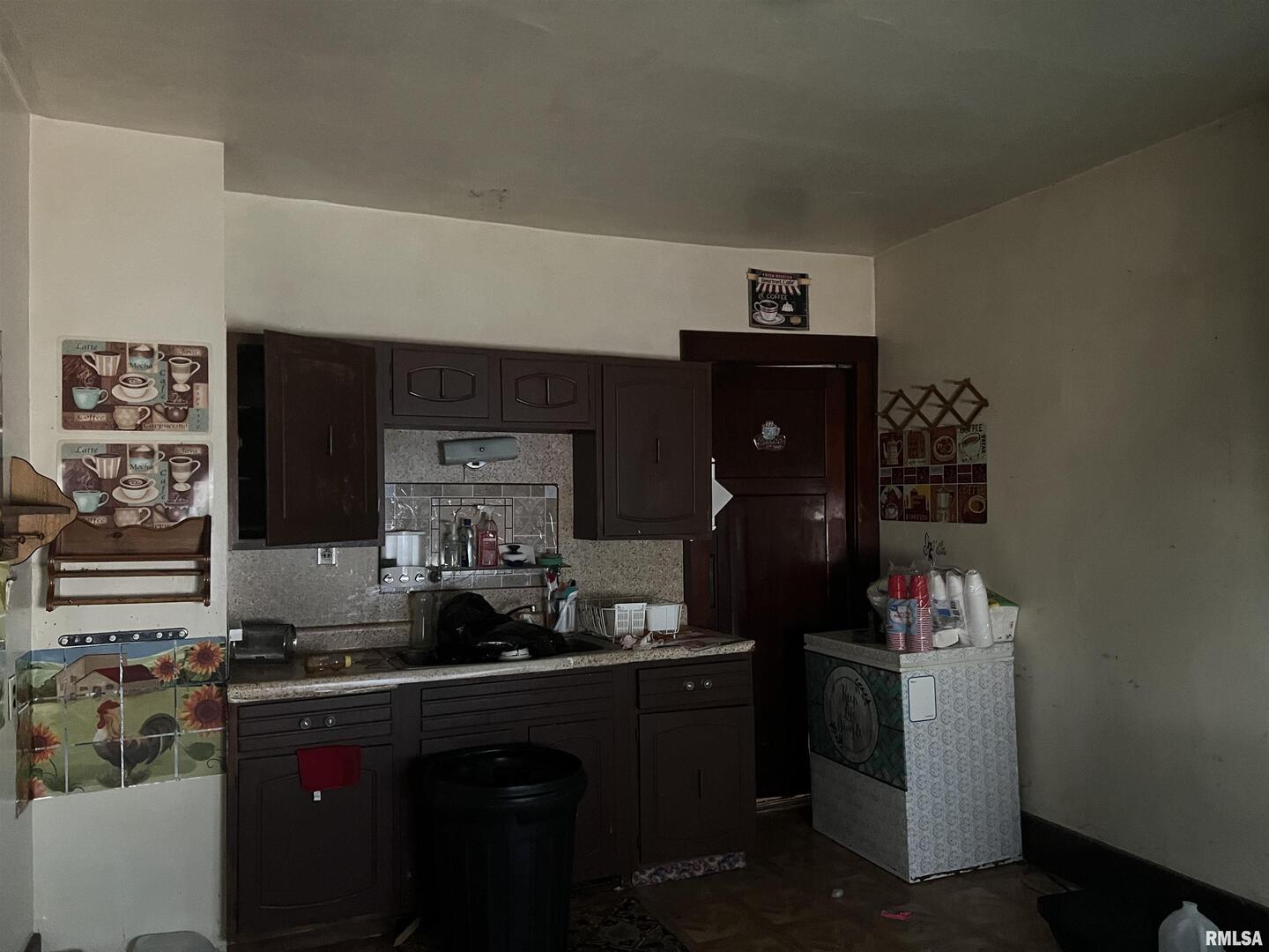 103 South 6th Street Clinton, IA 52732 - Photo 5 of 7 a kitchen with a sink and cabinets