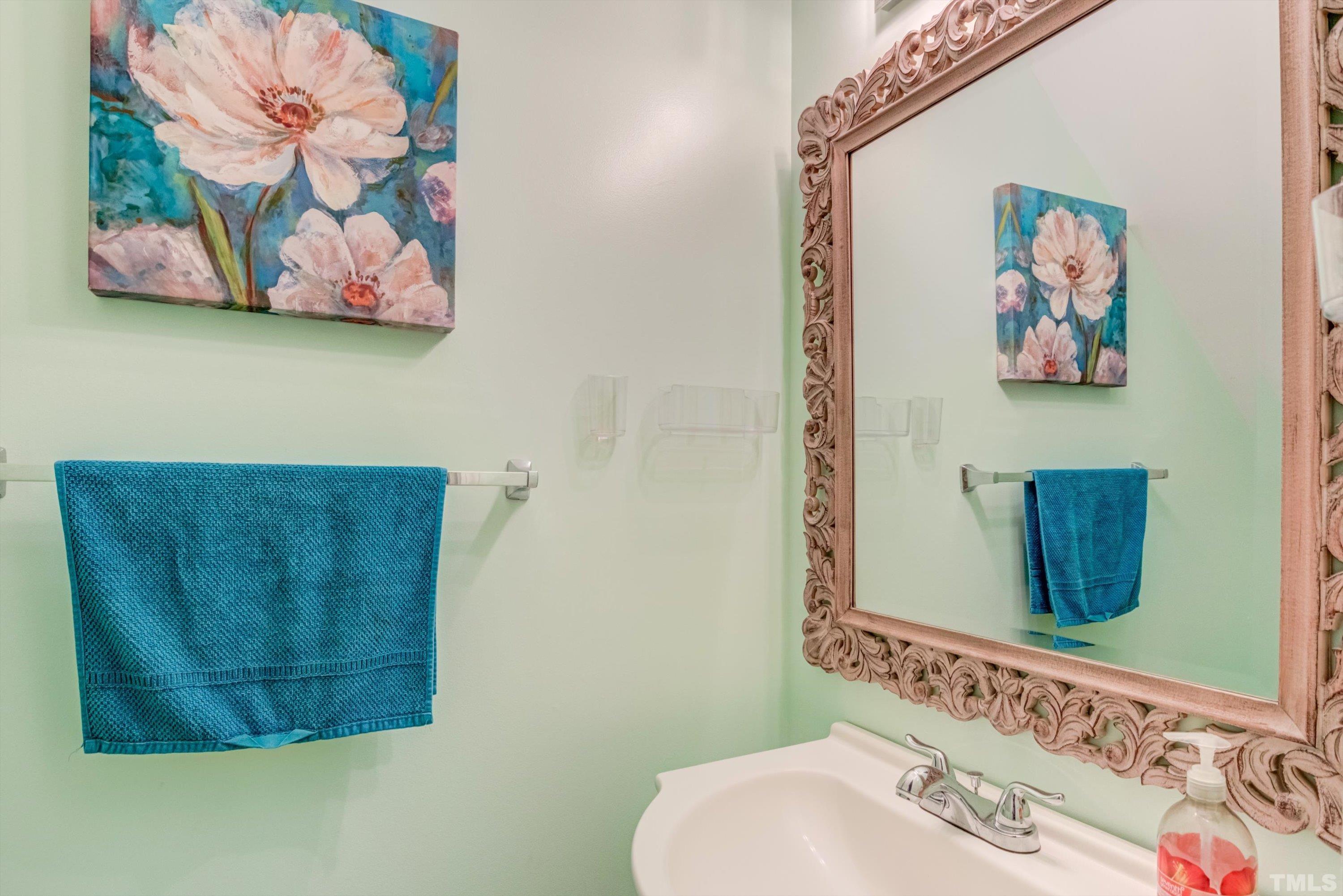 7846 Averette Field Drive Raleigh, NC 27616 - Photo 12 of 21 a bathroom with a sink and a mirror