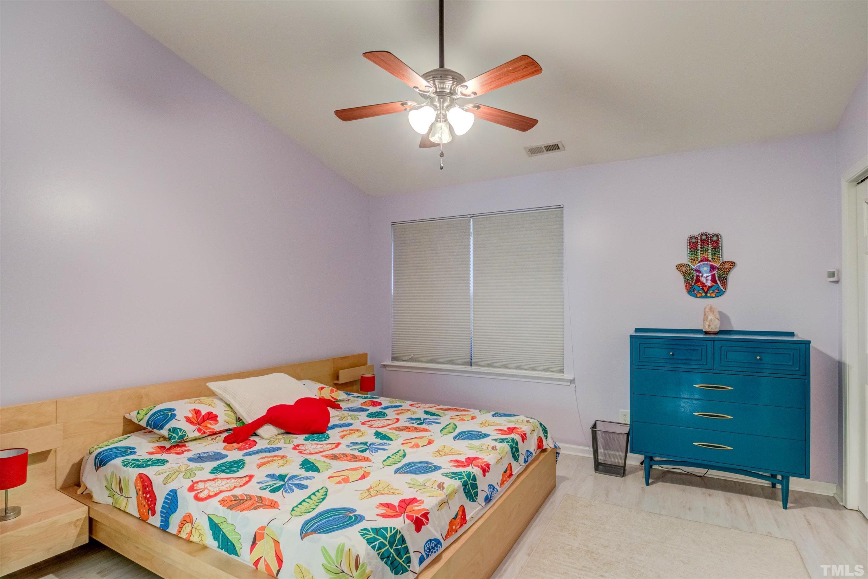 7846 Averette Field Drive Raleigh, NC 27616 - Photo 13 of 21 a bedroom with a bed and a dresser