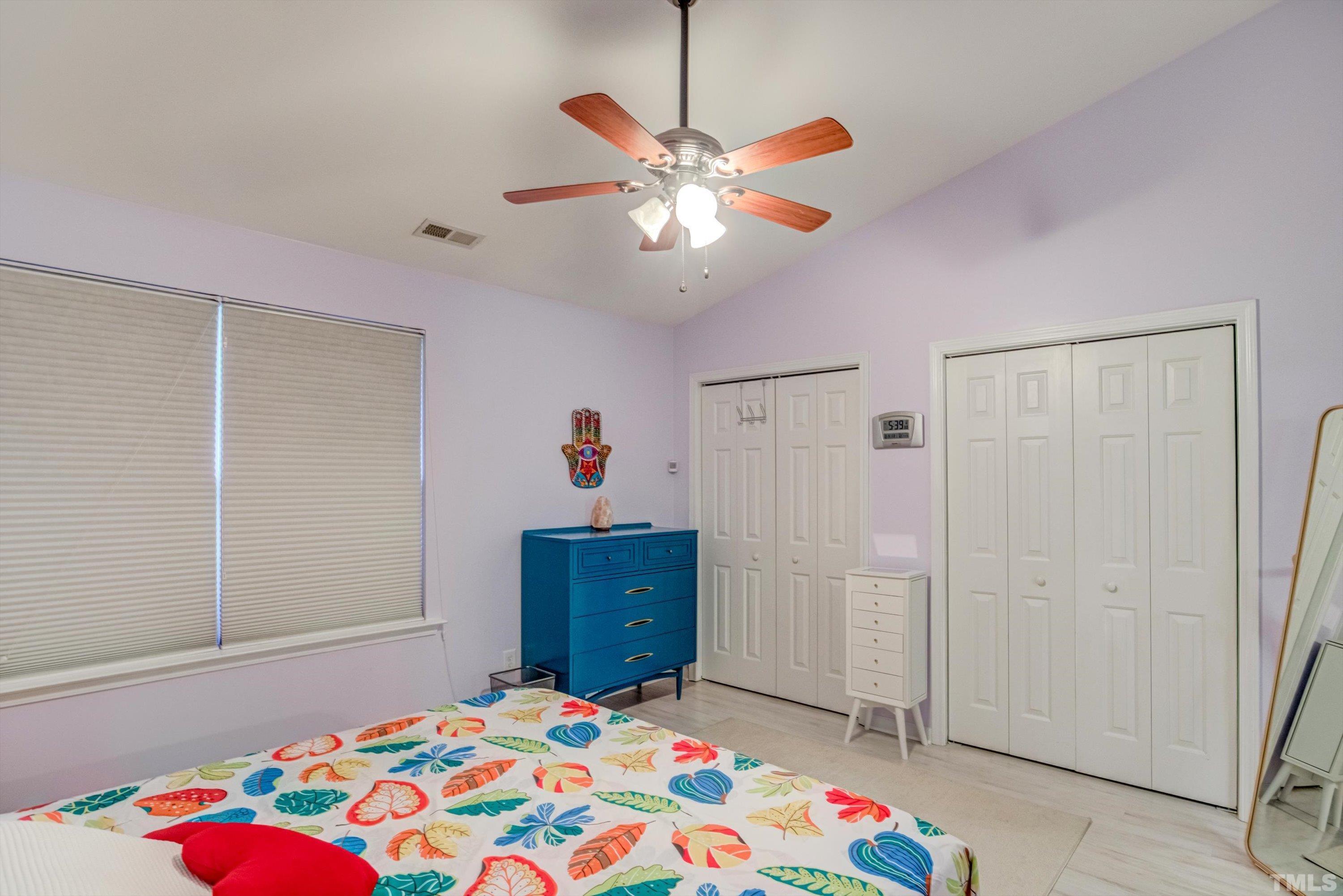 7846 Averette Field Drive Raleigh, NC 27616 - Photo 14 of 21 a bedroom with a bed and a chandelier