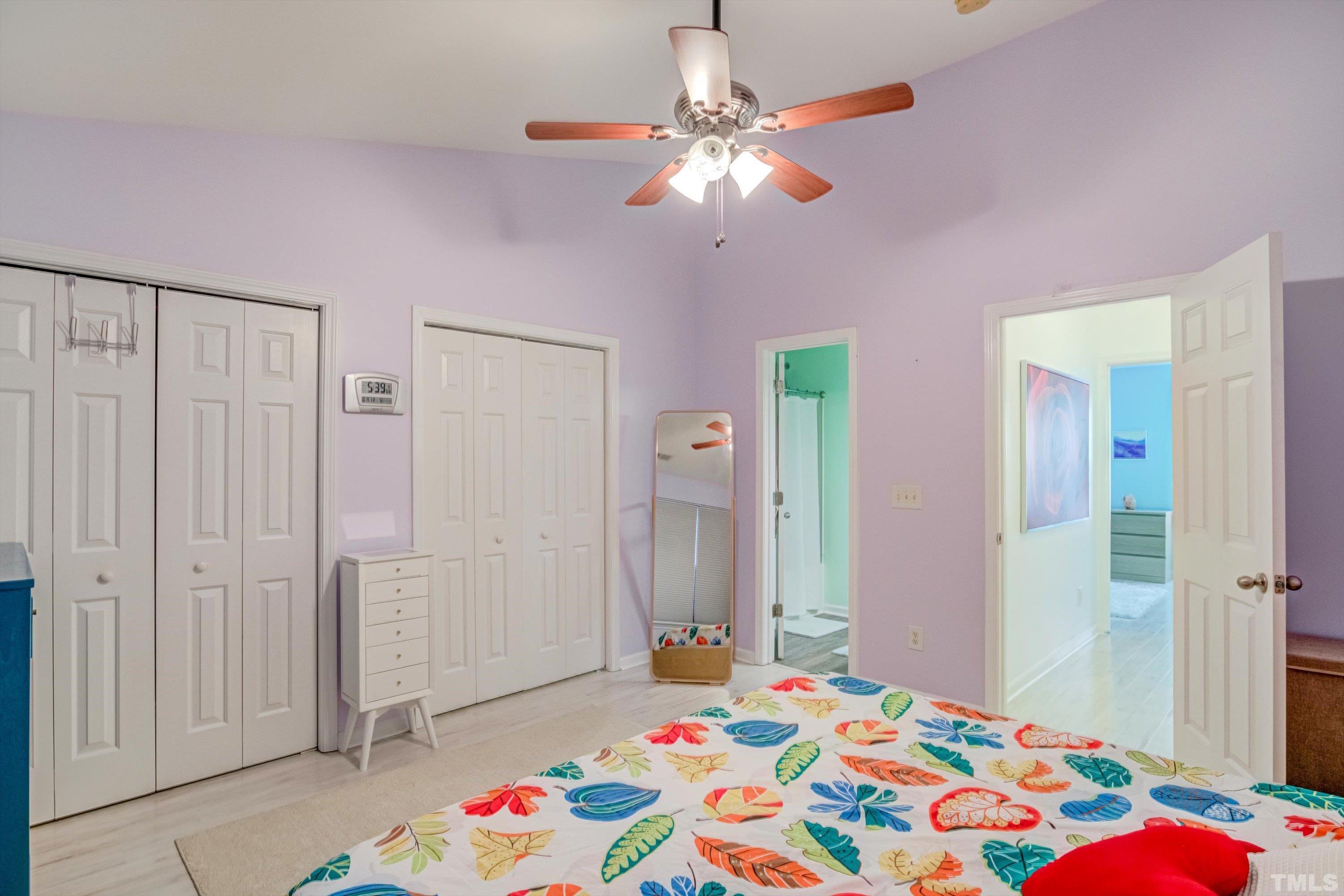 7846 Averette Field Drive Raleigh, NC 27616 - Photo 15 of 21 a bedroom with a bed and a chandelier
