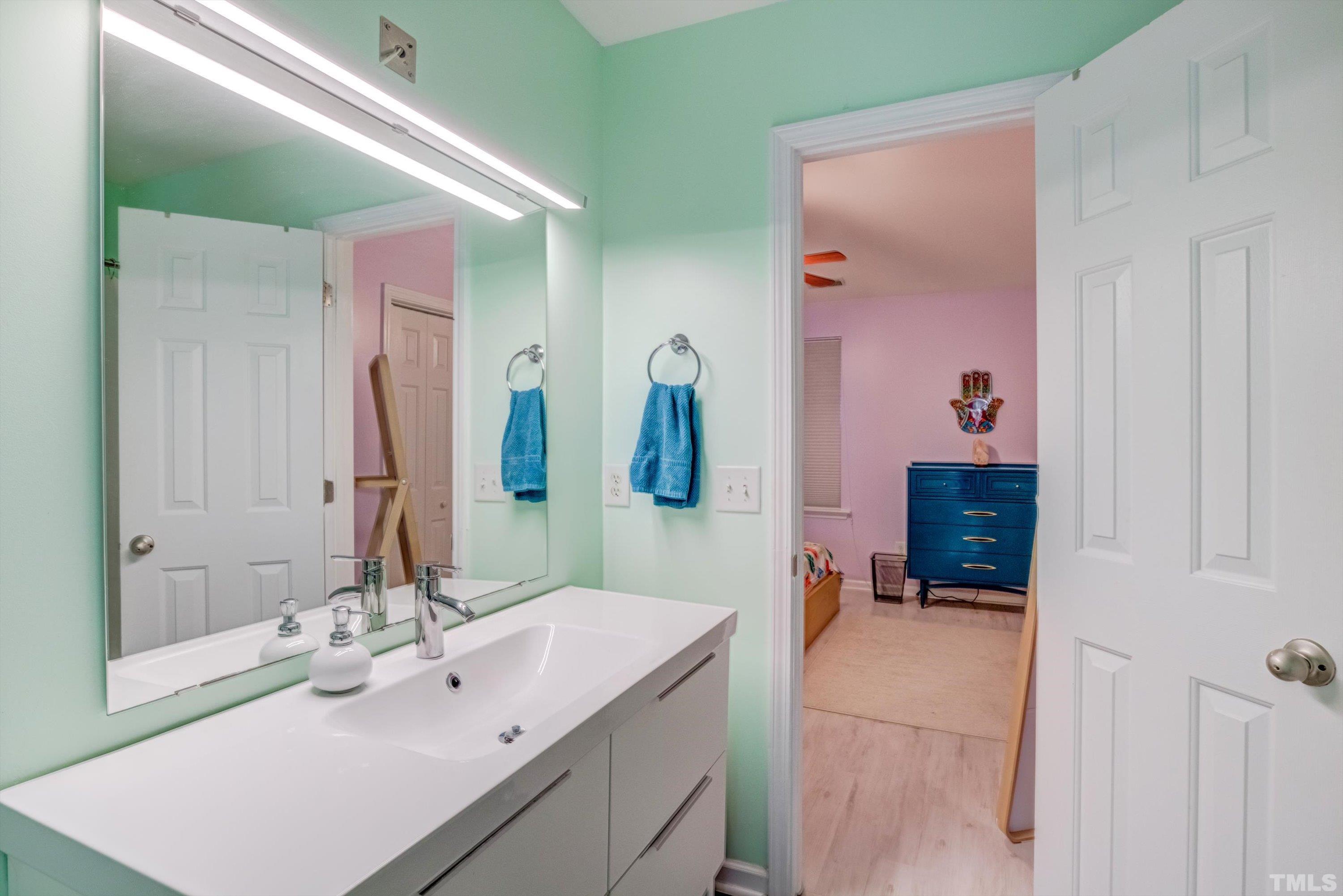 7846 Averette Field Drive Raleigh, NC 27616 - Photo 16 of 21 a bathroom with a sink vanity and mirror
