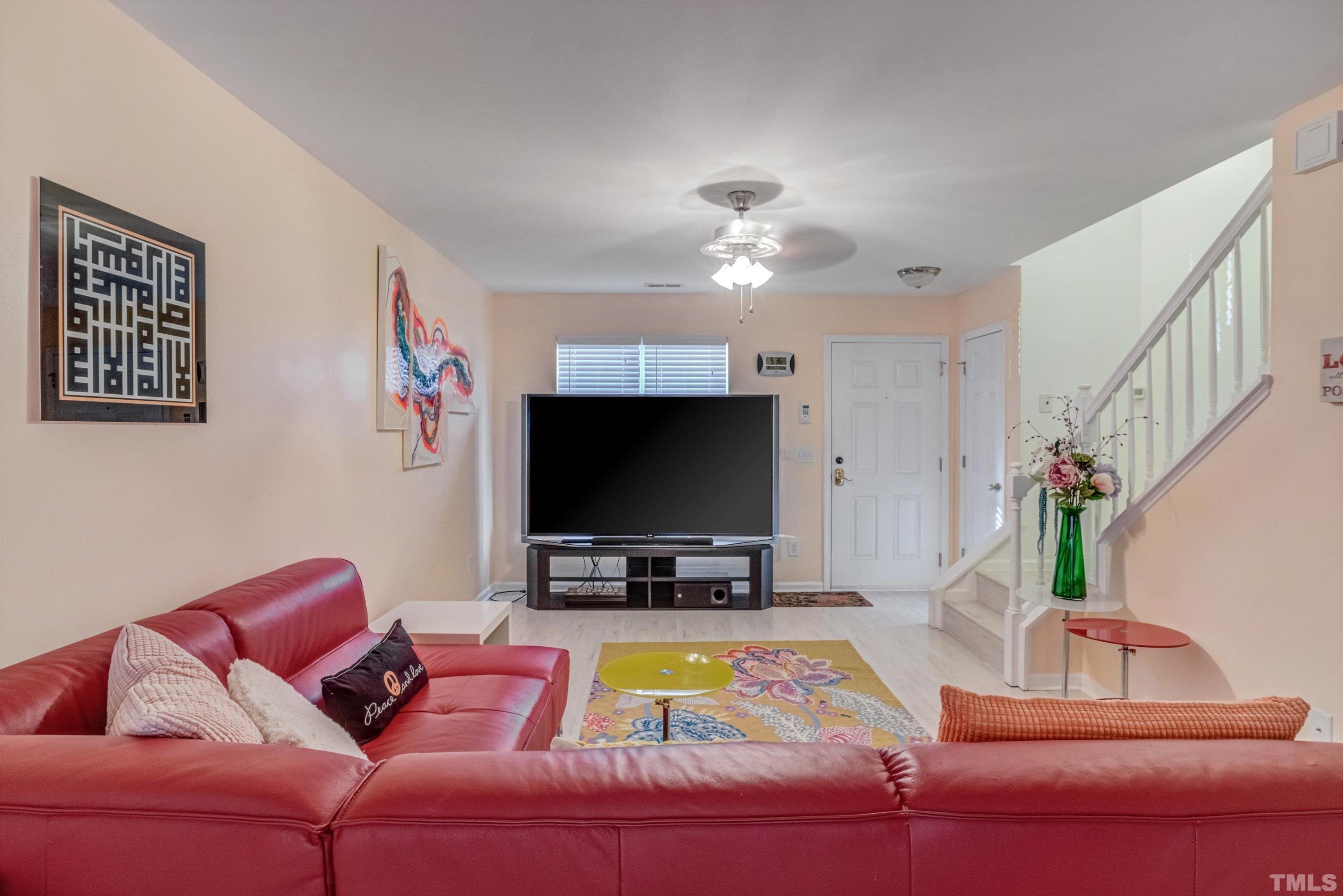 7846 Averette Field Drive Raleigh, NC 27616 - Photo 3 of 21 a living room with furniture and a flat screen tv