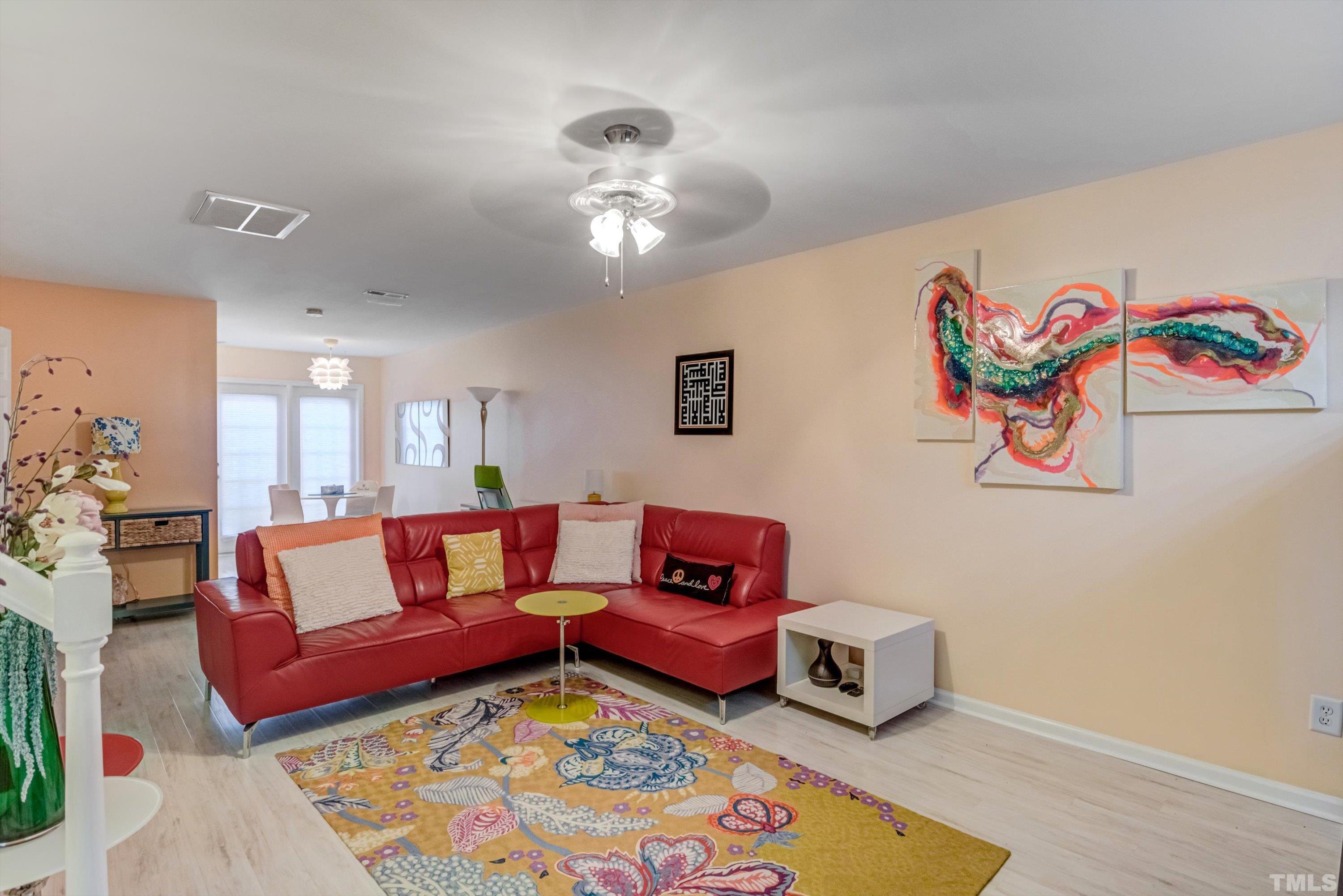 7846 Averette Field Drive Raleigh, NC 27616 - Photo 4 of 21 a living room with furniture and a wooden floor
