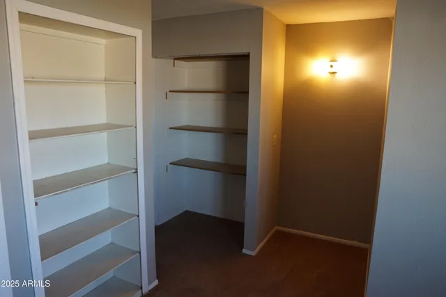 a white toilet sitting next to a bath tub