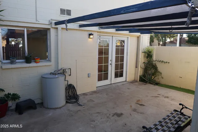 a view of a porch with furniture and a shower