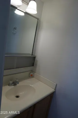 a white toilet sitting next to a shower