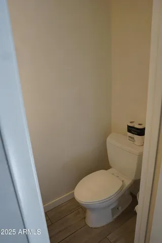 a dining room with furniture and a rug