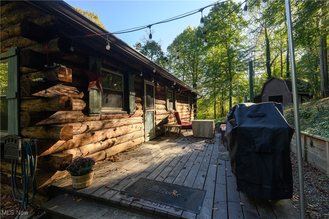 33201 Host Road Bowerston, OH 44695 - Photo 4 of 30 Wooden terrace featuring area for grilling and a storage unit