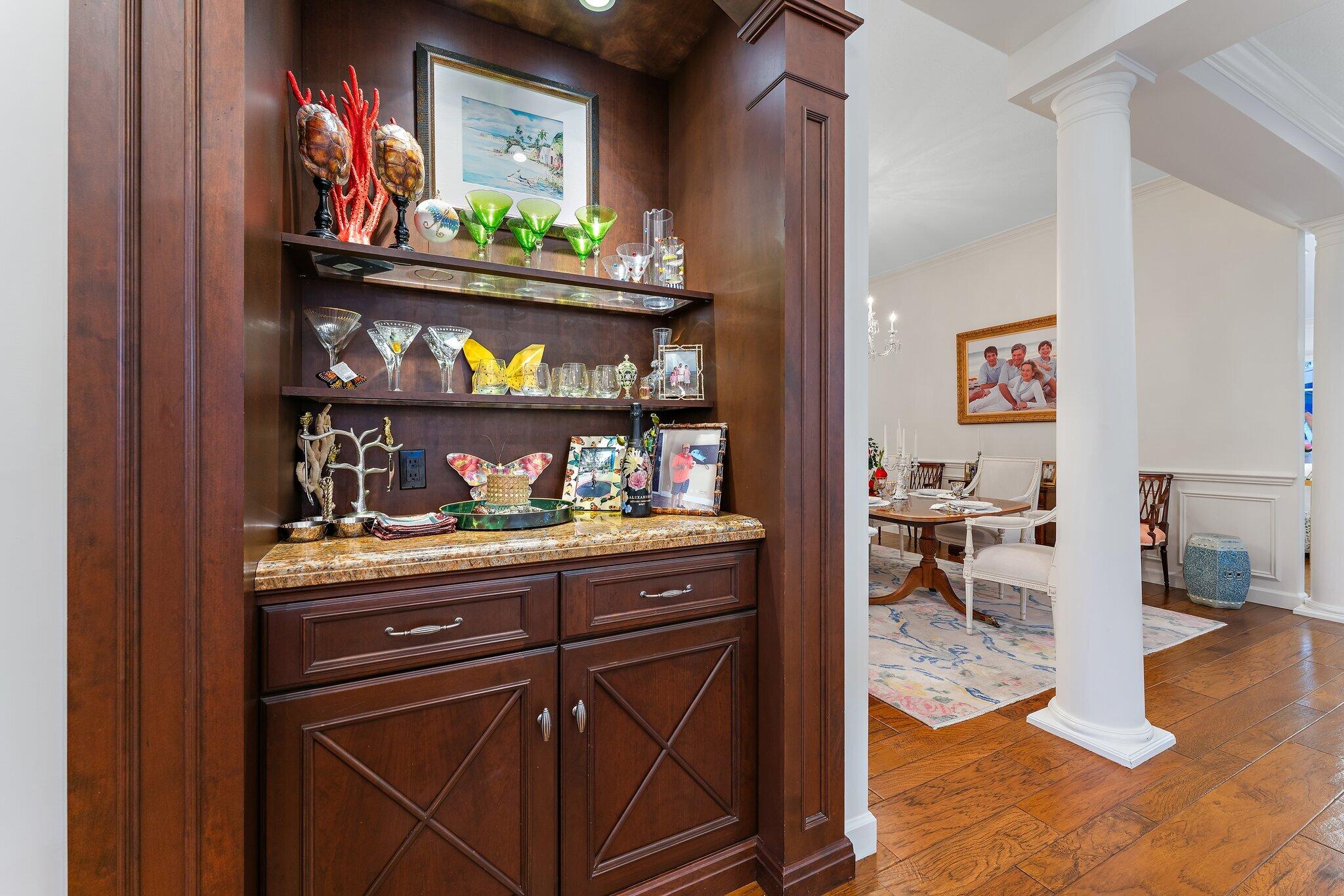 3230 West Channel Circle Jupiter, FL 33477 - Photo 12 of 67 a kitchen with stainless steel appliances granite countertop a stove and cabinets