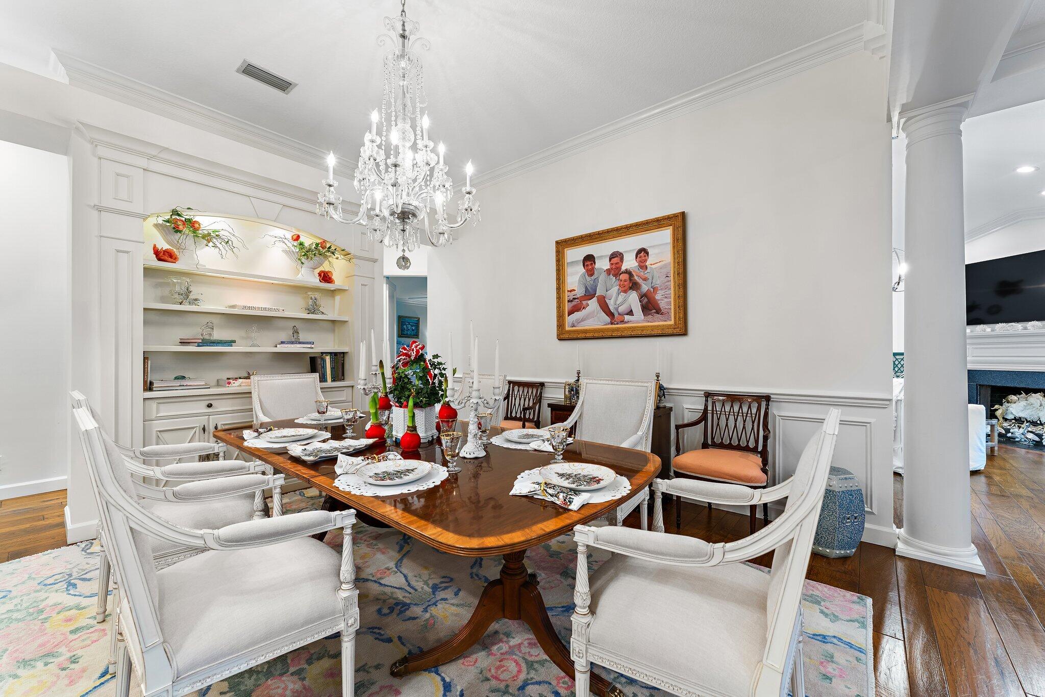 3230 West Channel Circle Jupiter, FL 33477 - Photo 15 of 67 a view of a dining room with furniture a chandelier and wooden floor