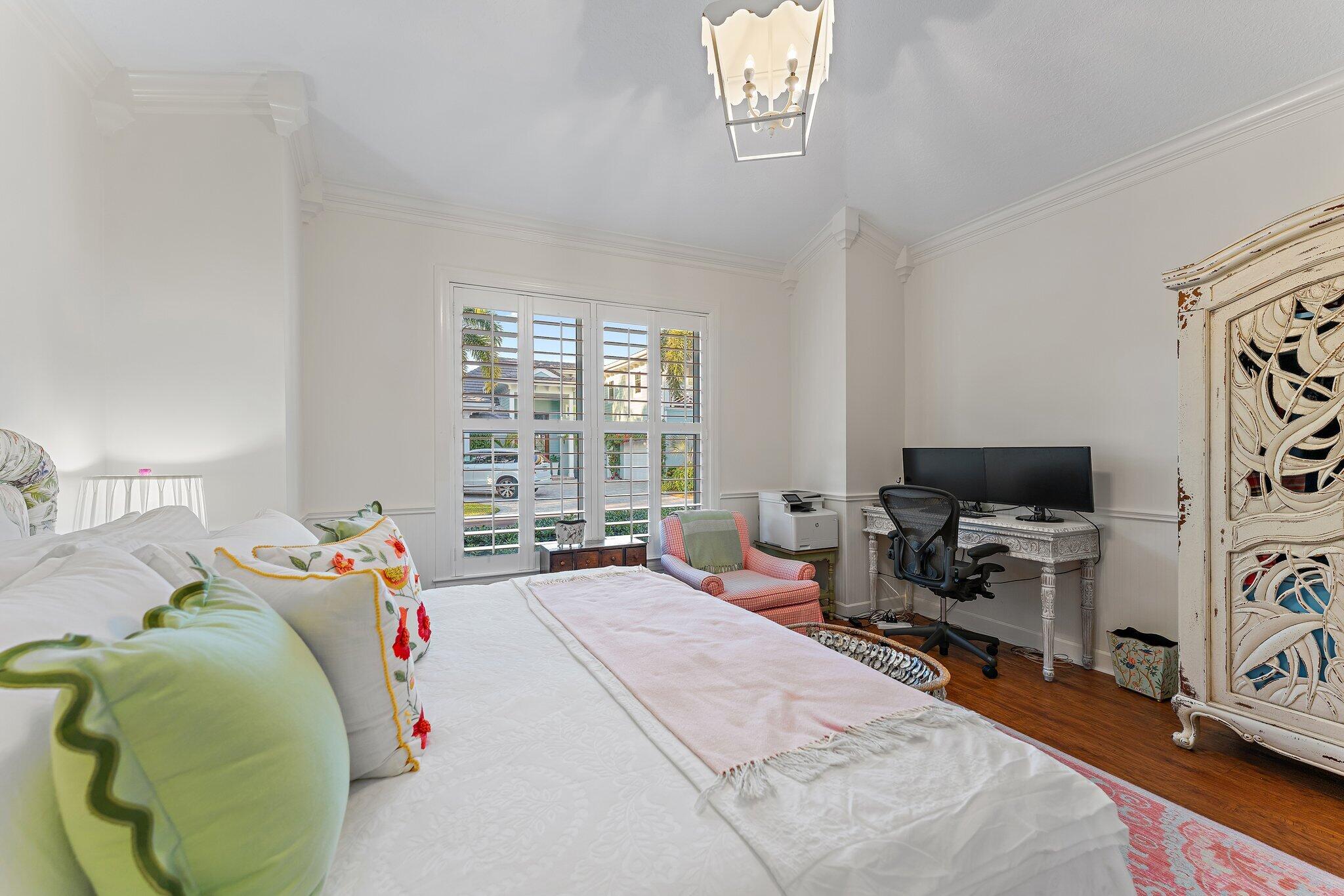 3230 West Channel Circle Jupiter, FL 33477 - Photo 17 of 67 a bedroom with a bed and a flat screen tv