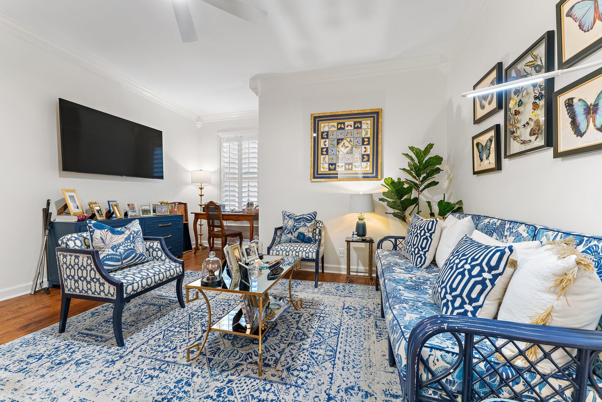 3230 West Channel Circle Jupiter, FL 33477 - Photo 21 of 67 a living room with furniture and a flat screen tv