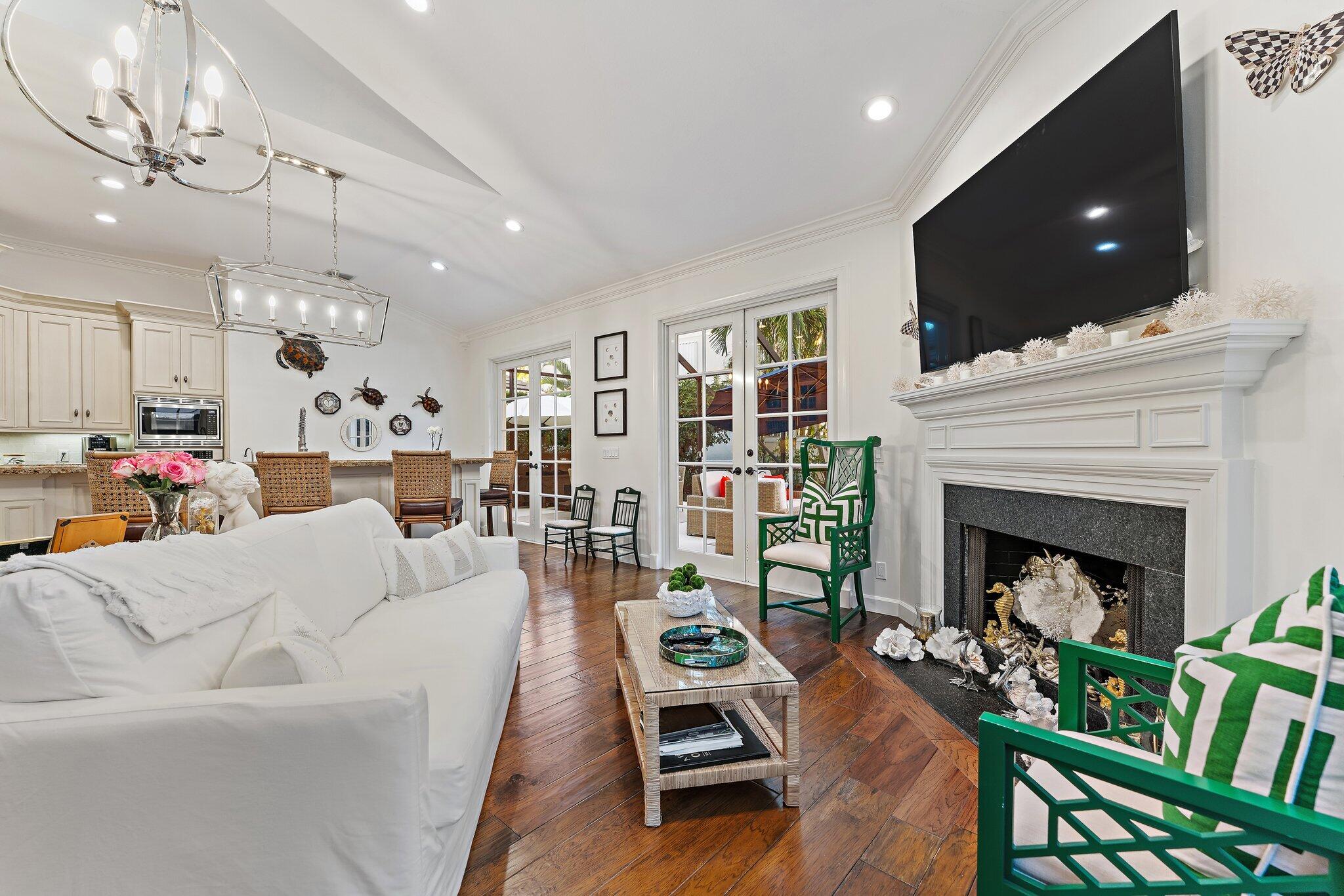 3230 West Channel Circle Jupiter, FL 33477 - Photo 25 of 67 a living room with furniture and a fireplace